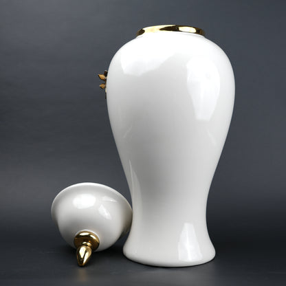 White ceramic decorative jar with gold cascading leaf design and lid