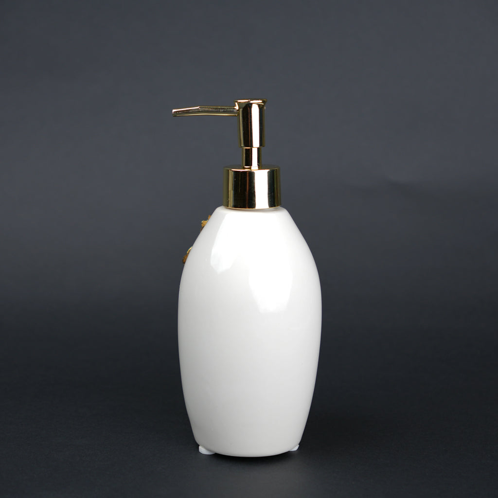 Ivory ceramic soap dispenser with gold floral detailing and metallic pump