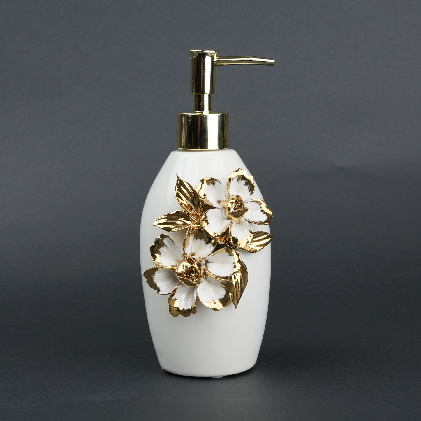 Ivory ceramic soap dispenser with gold floral detailing and metallic pump