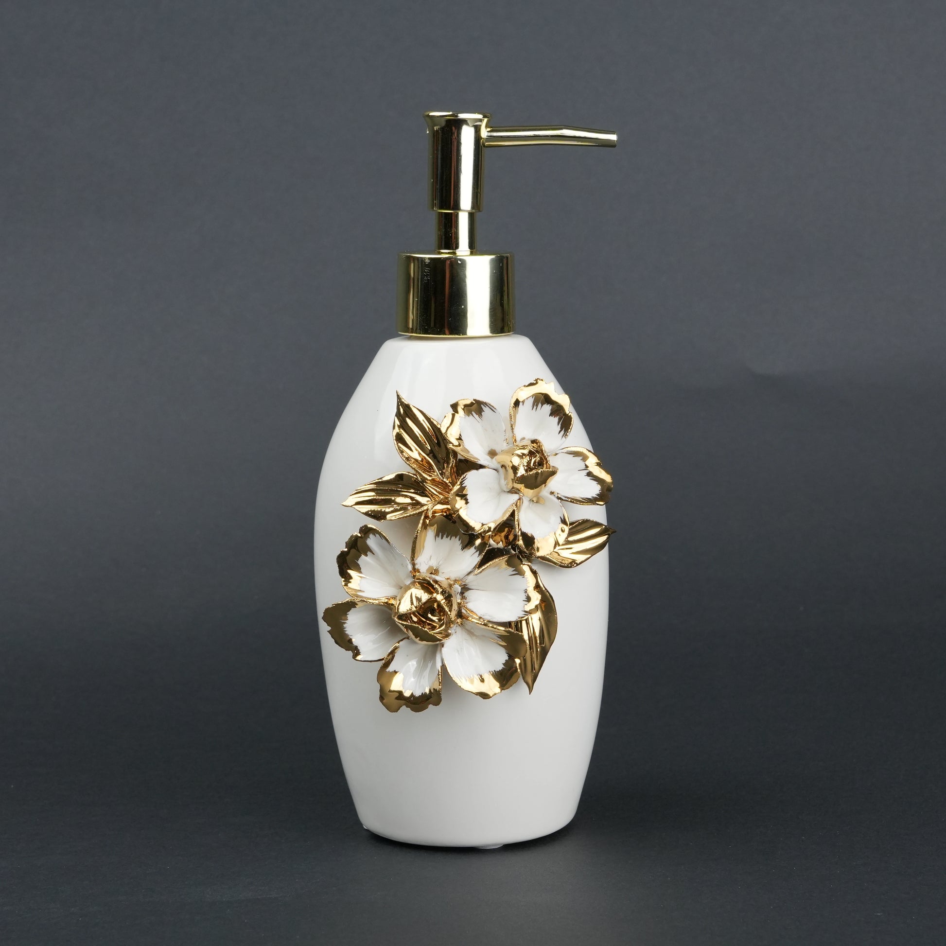 Ivory ceramic soap dispenser with gold floral detailing and metallic pump