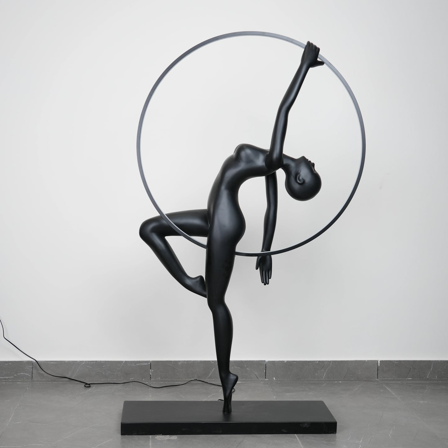Matte black human form floor lamp with LED halo ring modern luxury ambient lighting decor