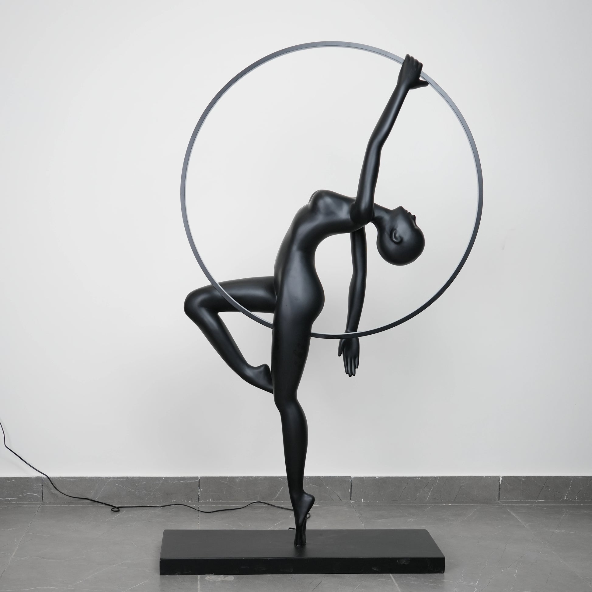 Matte black human form floor lamp with LED halo ring modern luxury ambient lighting decor