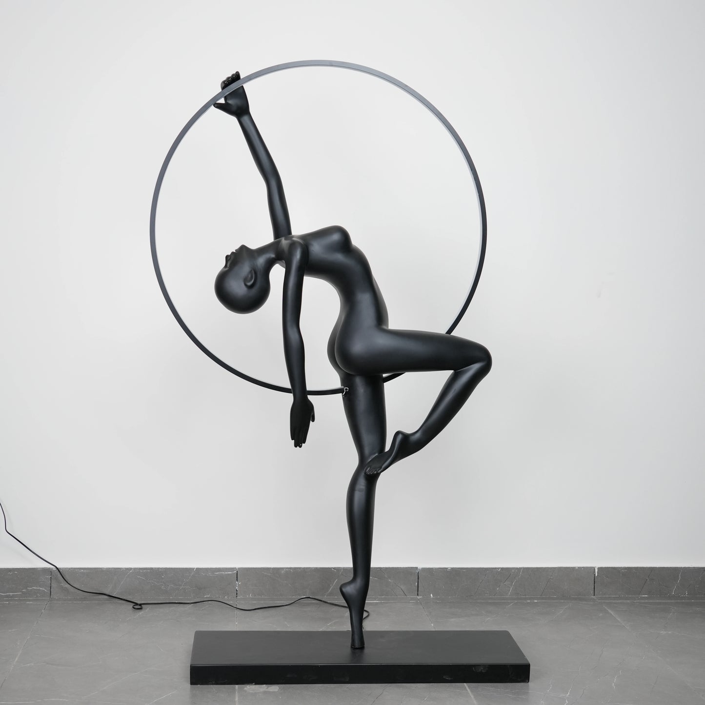 Matte black human form floor lamp with LED halo ring modern luxury ambient lighting decor