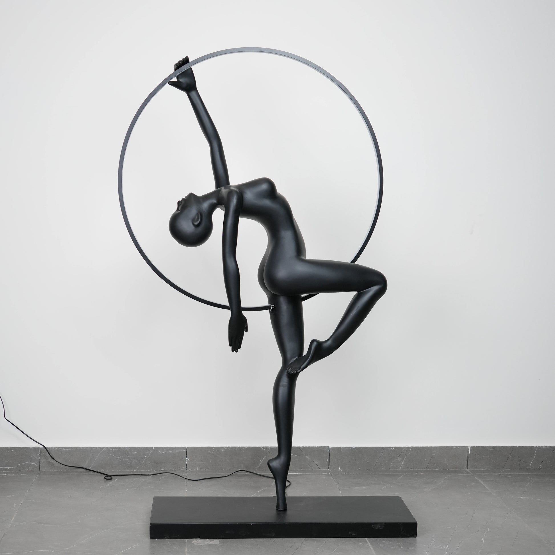 Matte black human form floor lamp with LED halo ring modern luxury ambient lighting decor