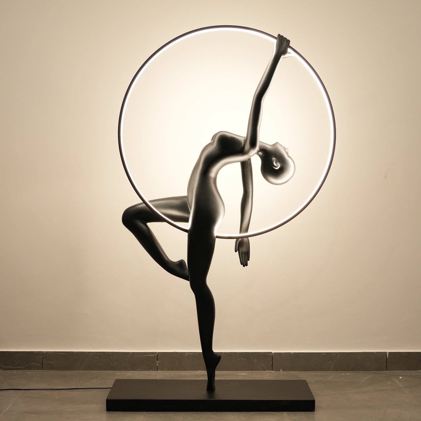 Matte black human form floor lamp with LED halo ring modern luxury ambient lighting decor
