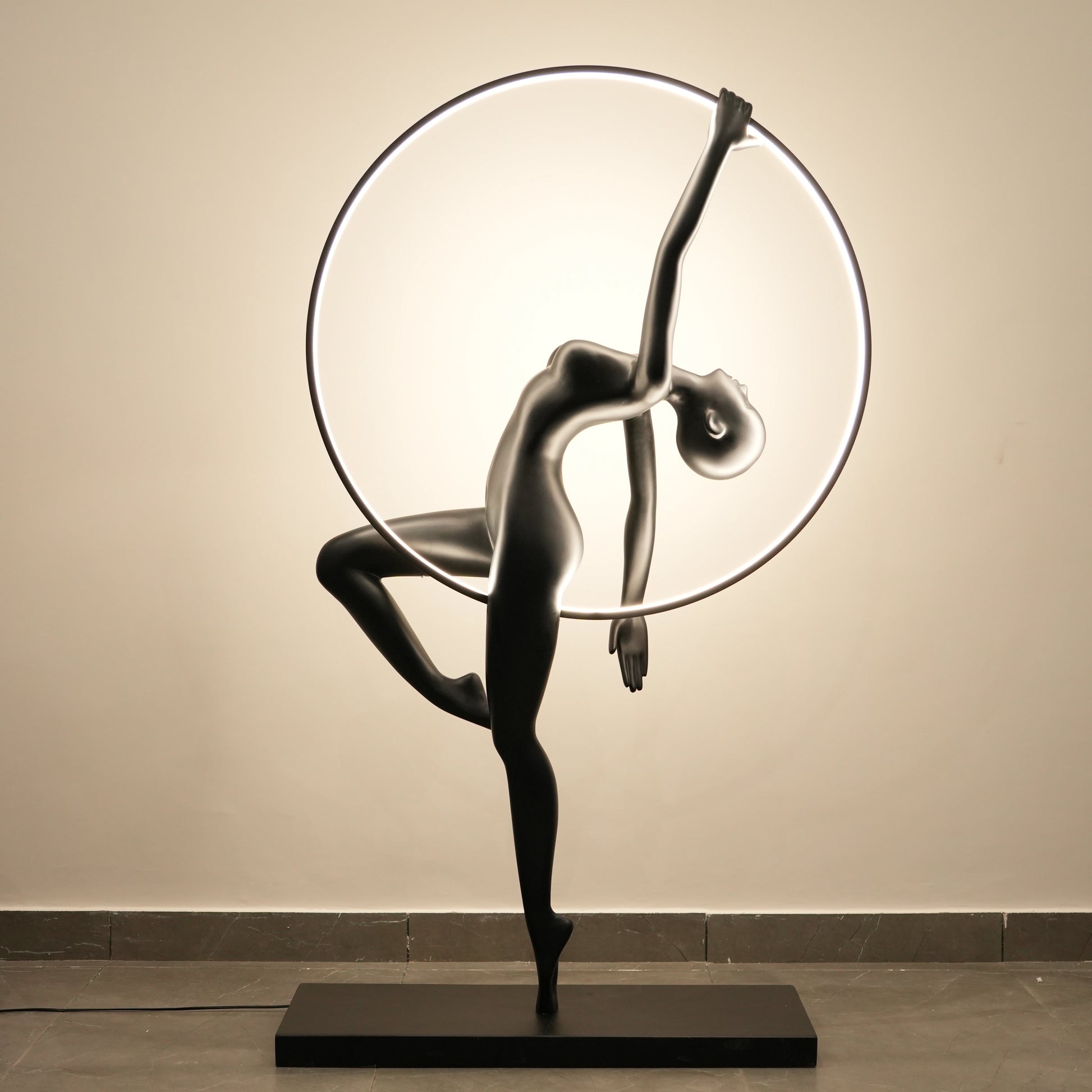 Matte black human form floor lamp with LED halo ring modern luxury ambient lighting decor