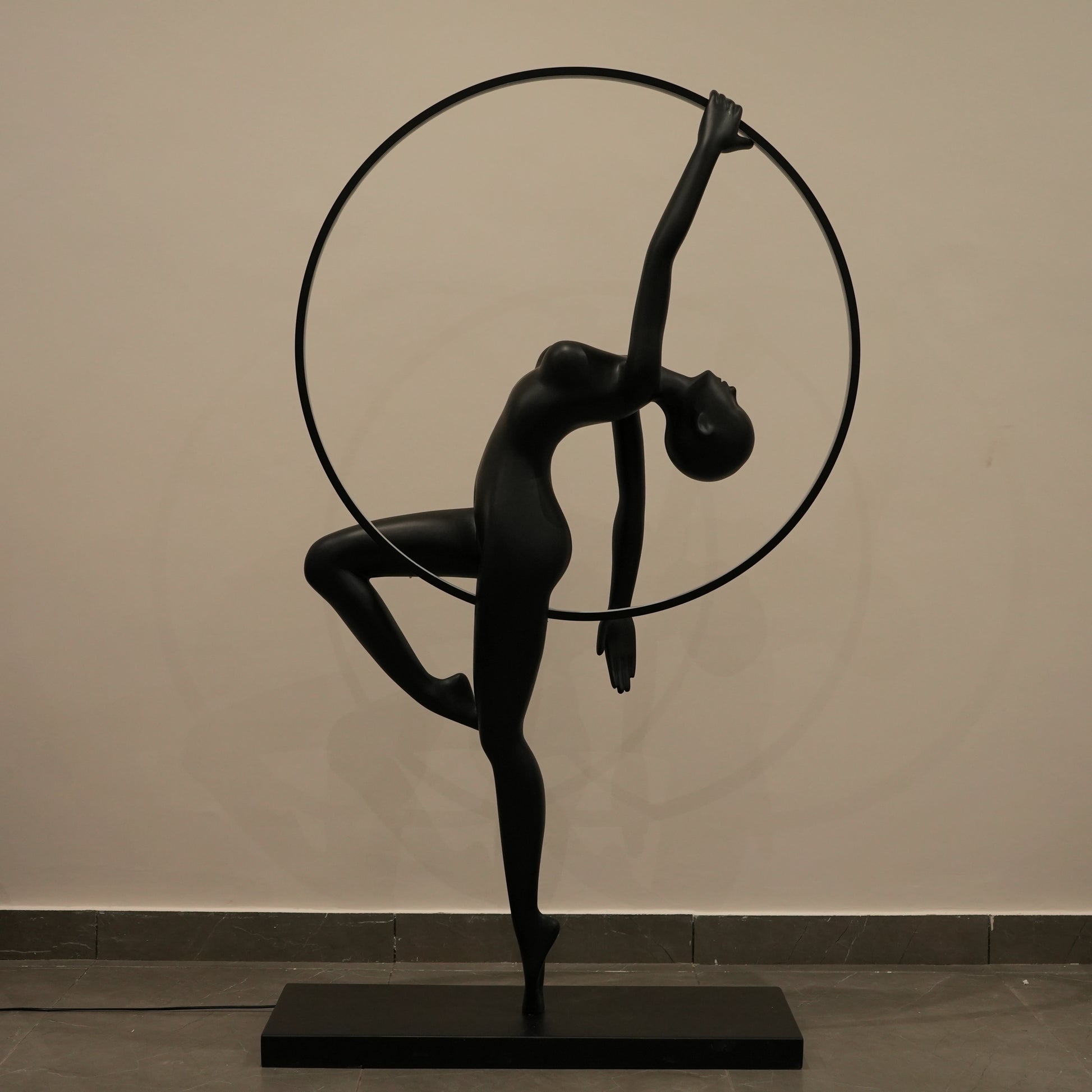 Matte black human form floor lamp with LED halo ring modern luxury ambient lighting decor