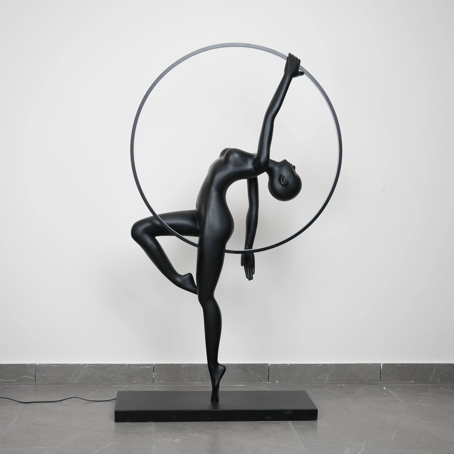 Matte black human form floor lamp with LED halo ring modern luxury ambient lighting decor
