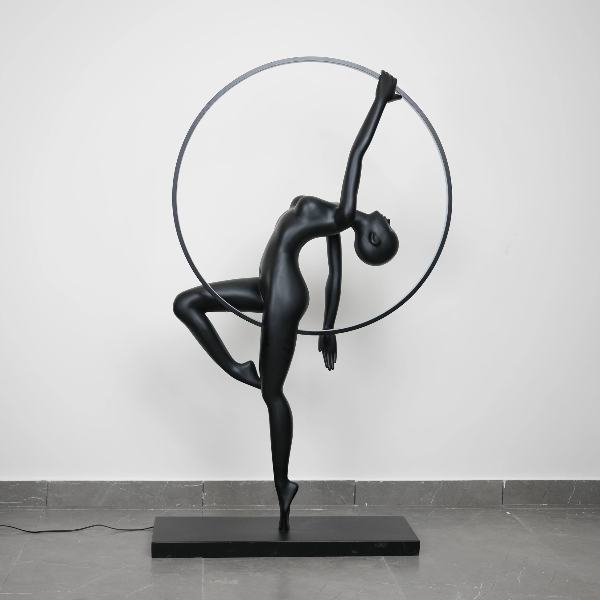 Matte black human form floor lamp with LED halo ring modern luxury ambient lighting decor