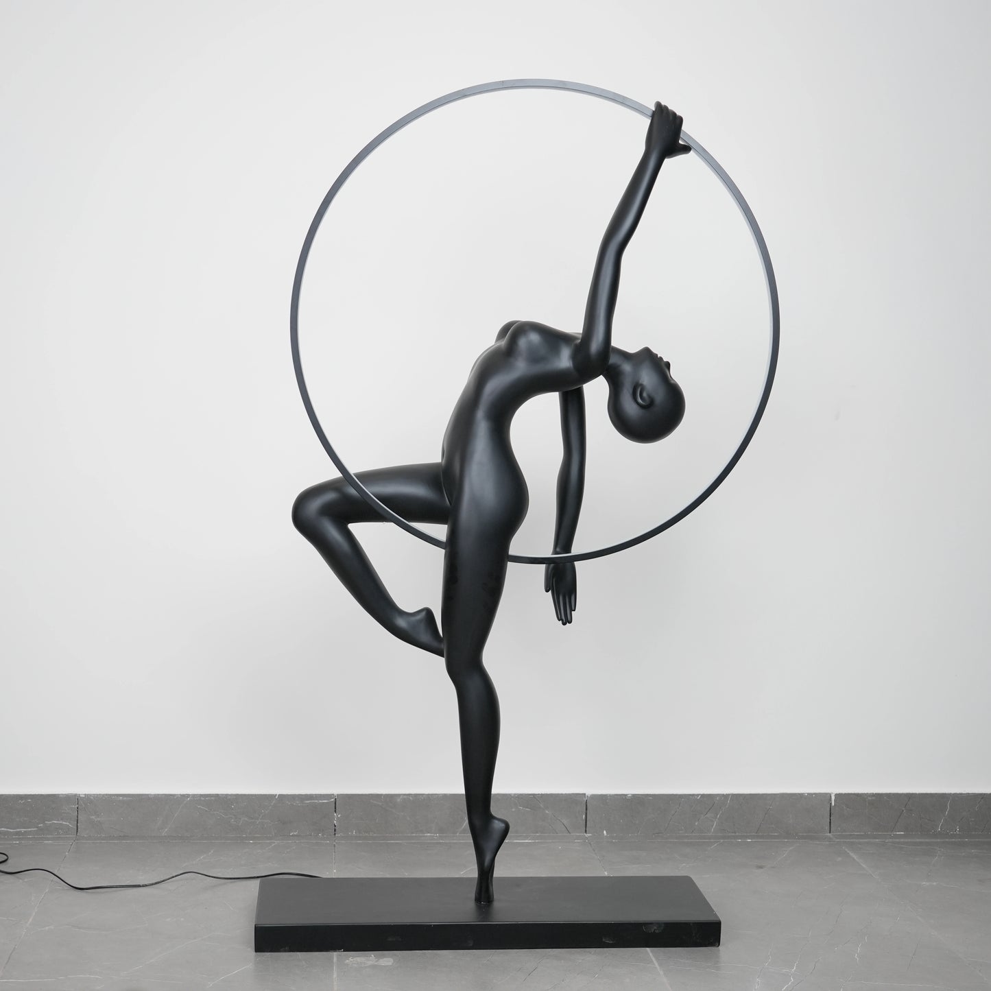 Matte black human form floor lamp with LED halo ring modern luxury ambient lighting decor