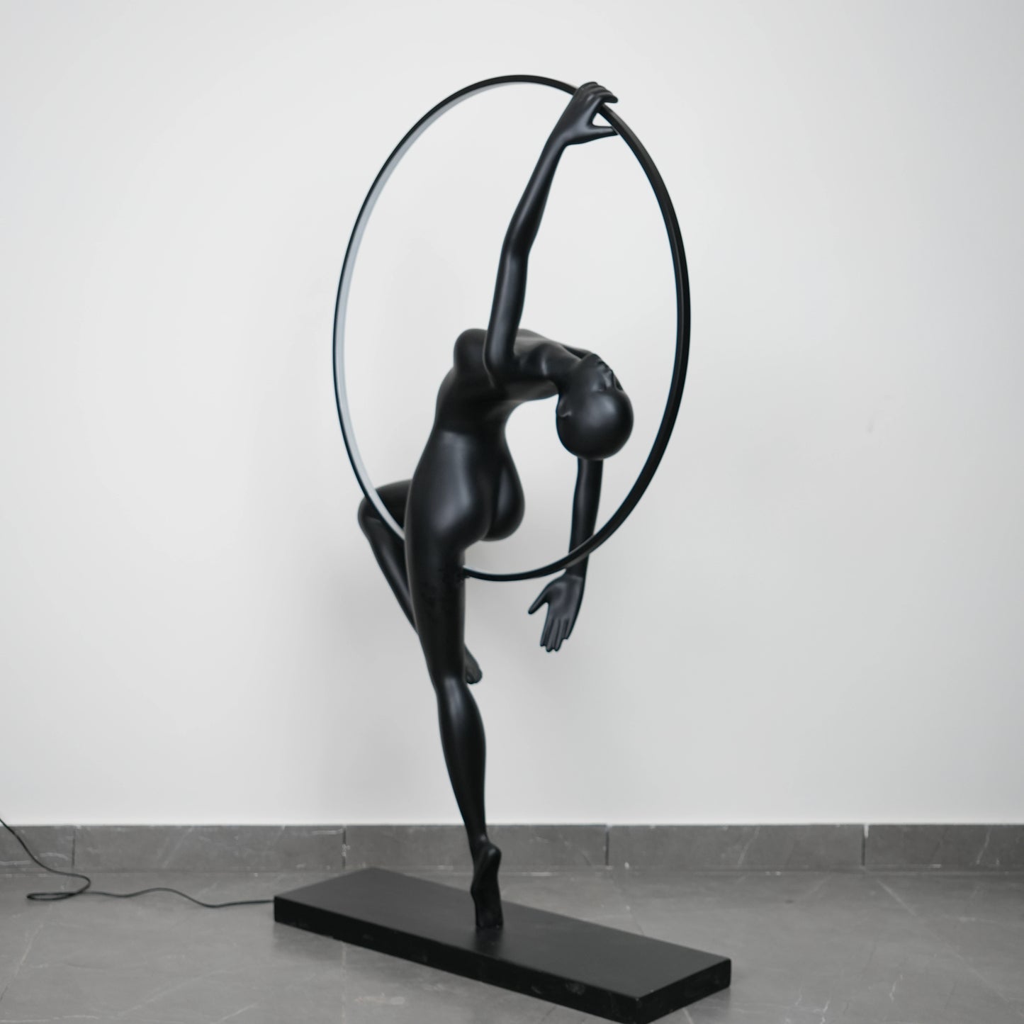 Matte black human form floor lamp with LED halo ring modern luxury ambient lighting decor