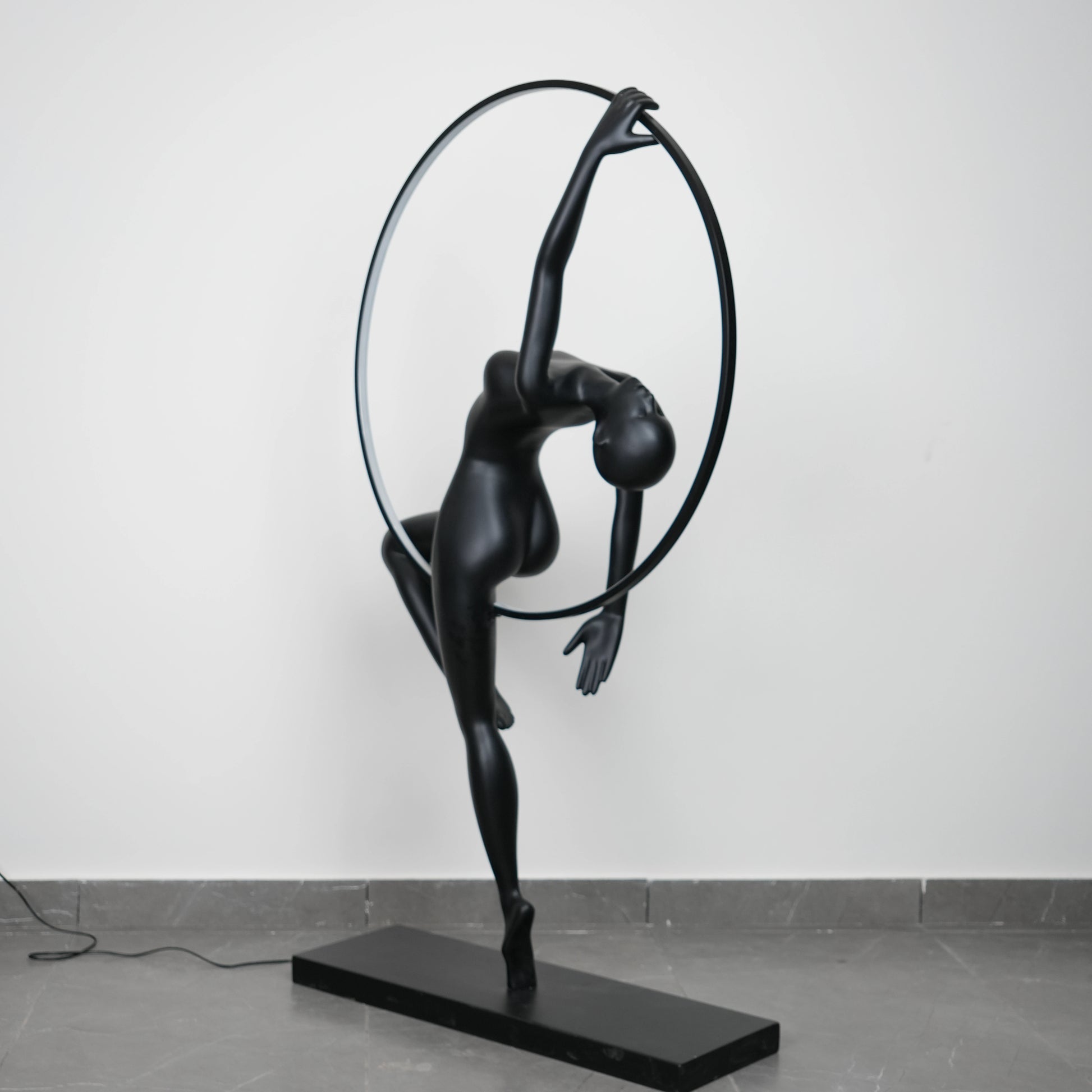 Matte black human form floor lamp with LED halo ring modern luxury ambient lighting decor