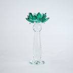 Emerald green glass lotus candle holder with faceted petals and clear crystal base