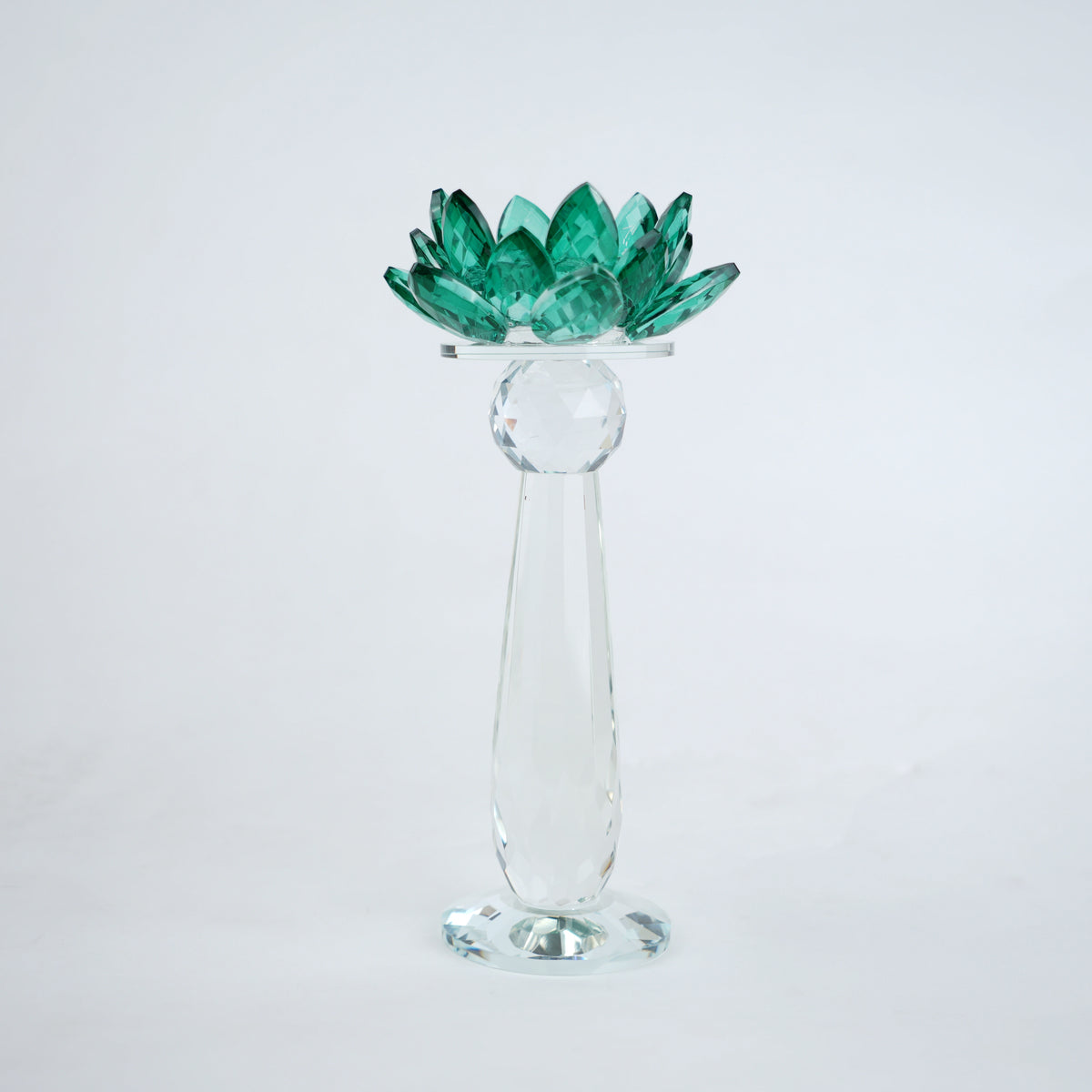 Emerald green glass lotus candle holder with faceted petals and clear crystal base