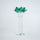 Emerald green glass lotus candle holder with faceted petals and clear crystal base