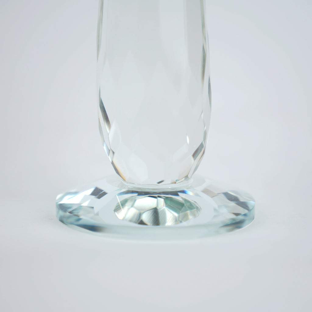 Emerald green glass lotus candle holder with faceted petals and clear crystal base