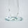 Emerald green glass lotus candle holder with faceted petals and clear crystal base