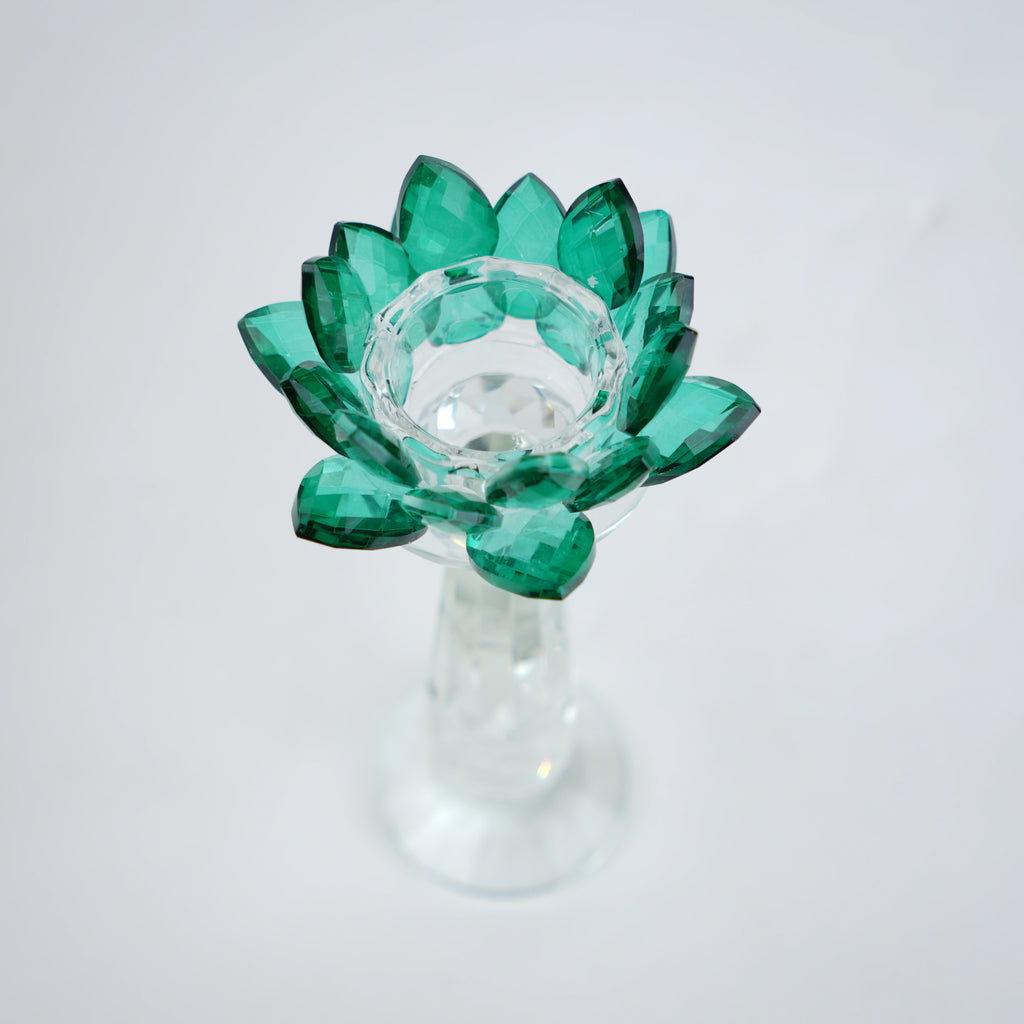 Emerald green glass lotus candle holder with faceted petals and clear crystal base