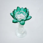 Emerald green glass lotus candle holder with faceted petals and clear crystal base