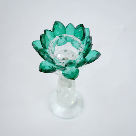 Emerald green glass lotus candle holder with faceted petals and clear crystal base