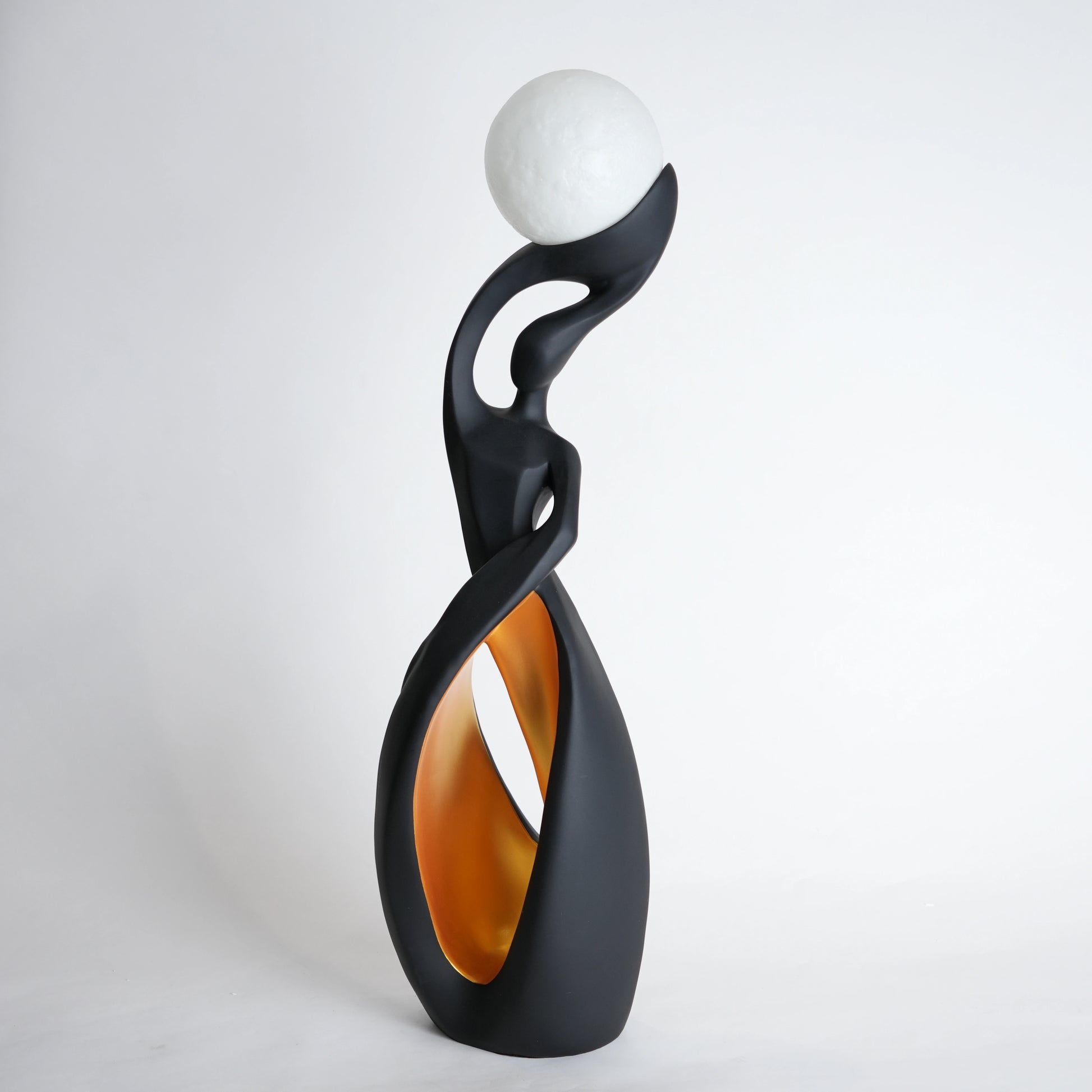 modern sculptural table lamp with glowing orb ambient lighting