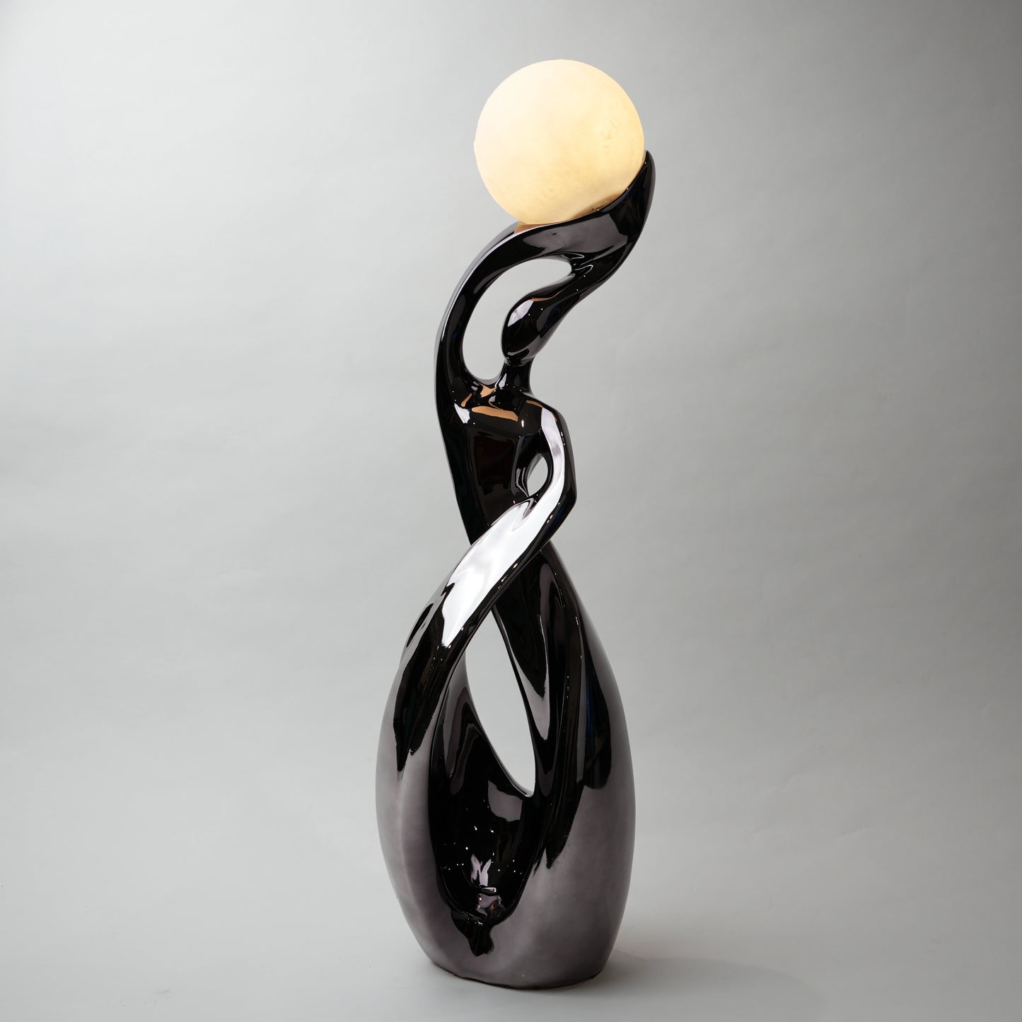 modern sculptural table lamp with glowing orb ambient lighting