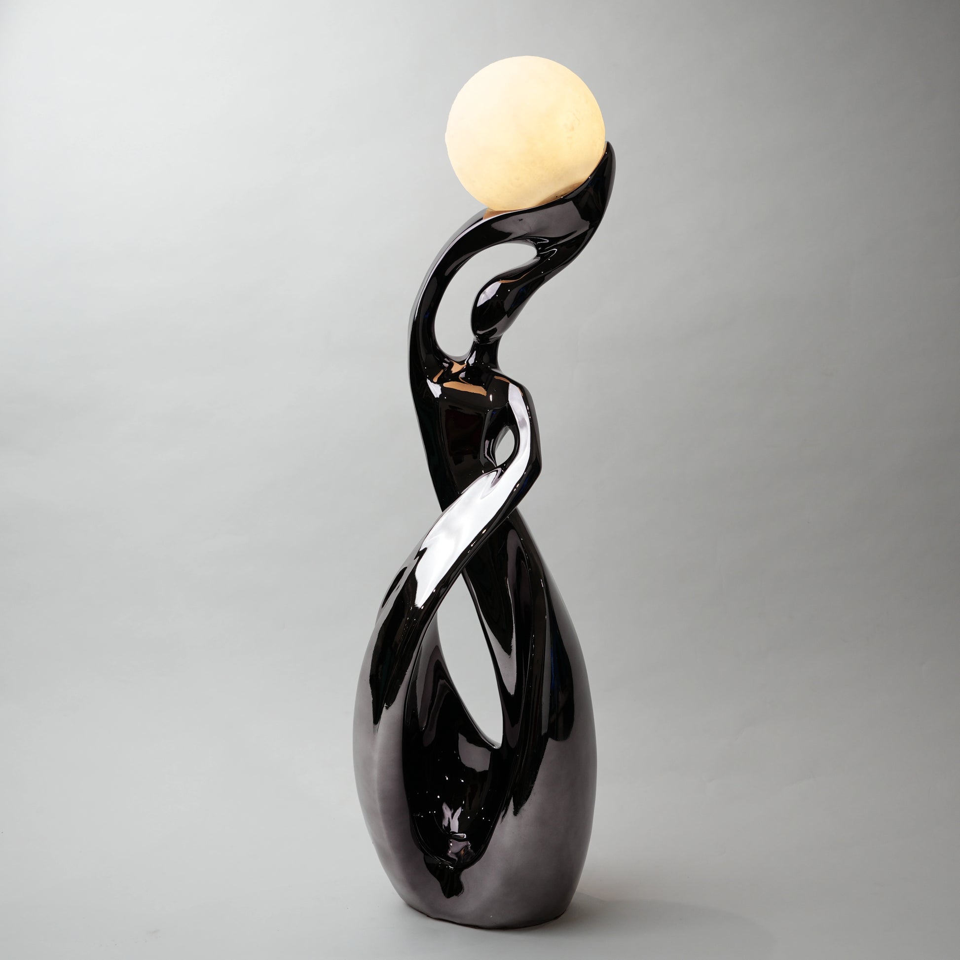 modern sculptural table lamp with glowing orb ambient lighting
