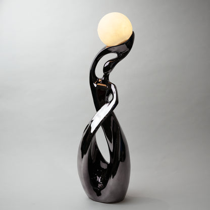 modern sculptural table lamp with glowing orb ambient lighting