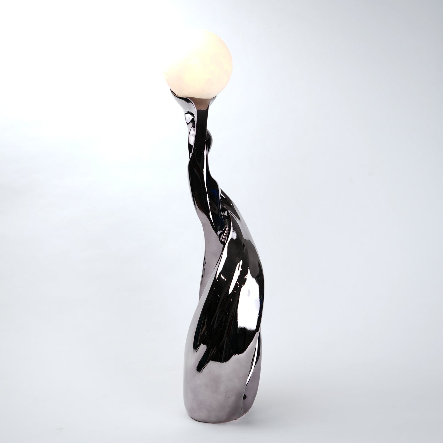 modern sculptural table lamp with glowing orb ambient lighting