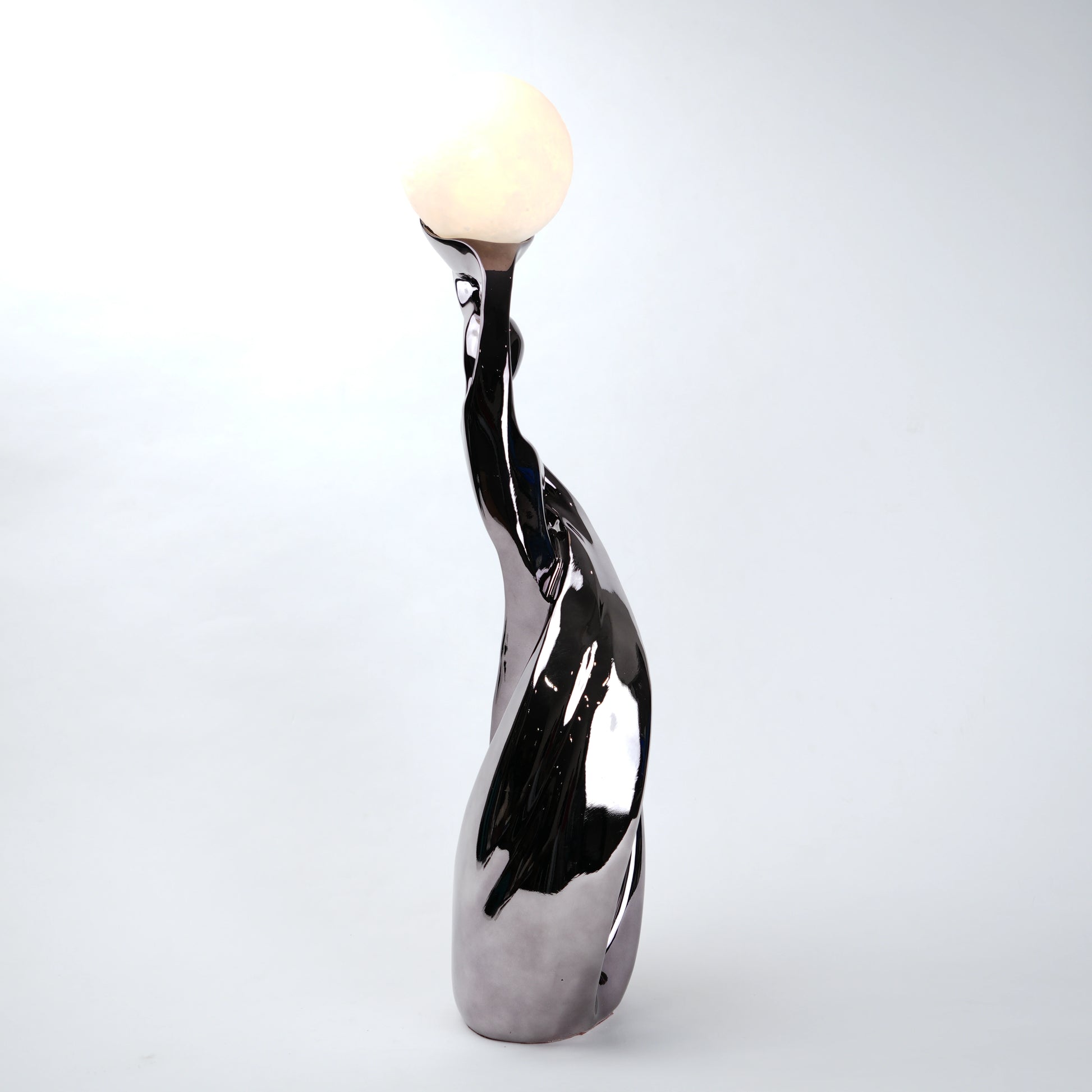 modern sculptural table lamp with glowing orb ambient lighting