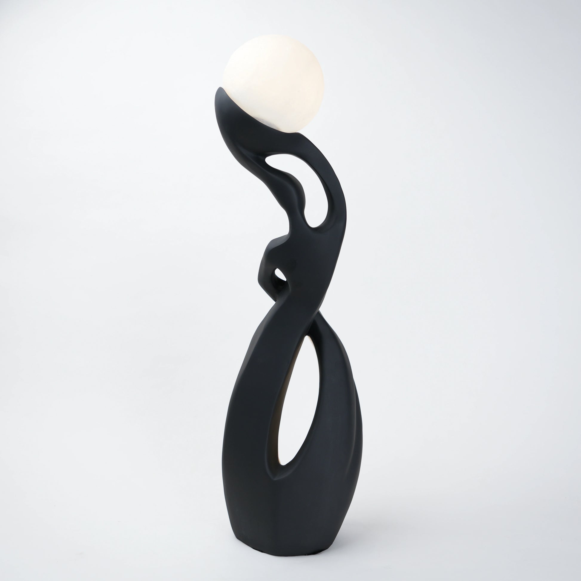 modern sculptural table lamp with glowing orb ambient lighting