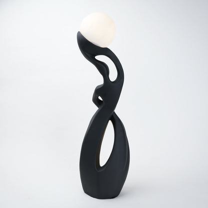 modern sculptural table lamp with glowing orb ambient lighting
