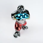 Metallic figurine with glowing blue eyes on a white background