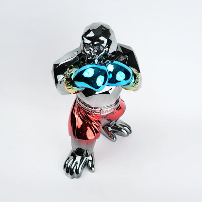 Metallic figurine with glowing blue eyes on a white background