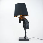 Horse table lamp featuring a detailed horse-shaped base with a premium finish, paired with a fabric lampshade that provides soft ambient lighting, designed as a decorative and functional lighting piece.