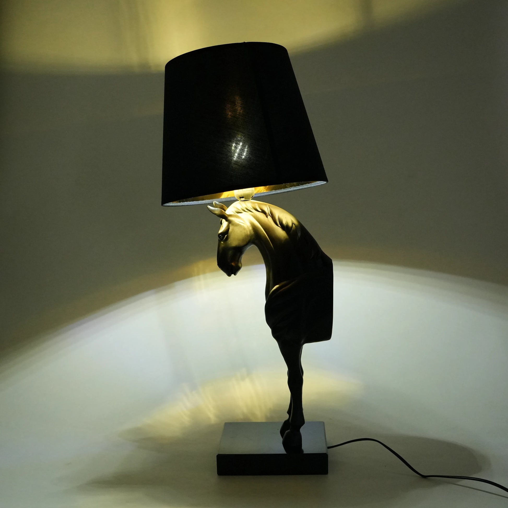 Horse table lamp featuring a detailed horse-shaped base with a premium finish, paired with a fabric lampshade that provides soft ambient lighting, designed as a decorative and functional lighting piece.