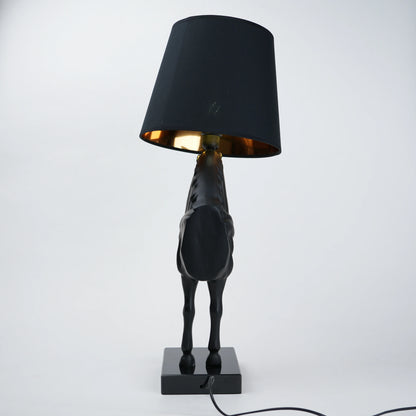 Black horse-shaped table lamp with a black shade on a white background