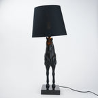 Horse table lamp featuring a detailed horse-shaped base with a premium finish, paired with a fabric lampshade that provides soft ambient lighting, designed as a decorative and functional lighting piece.