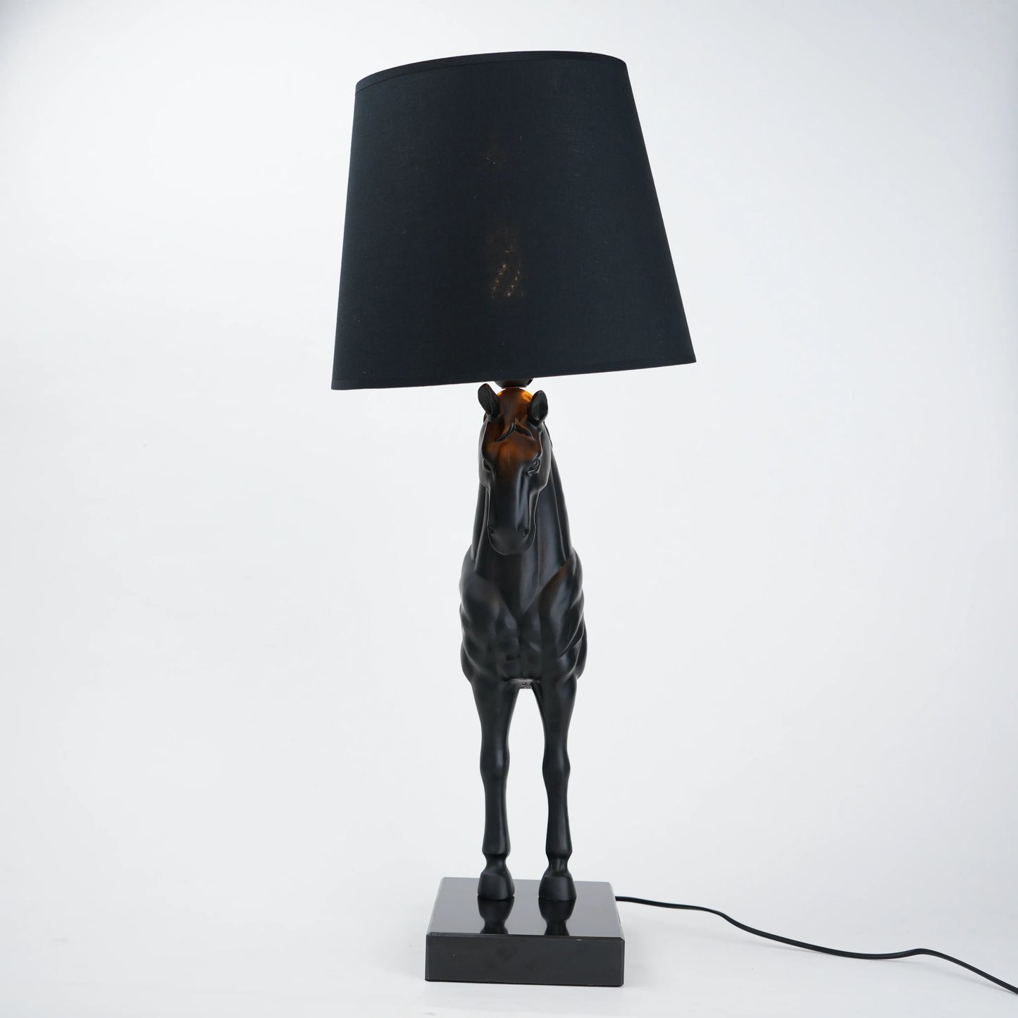 Horse table lamp featuring a detailed horse-shaped base with a premium finish, paired with a fabric lampshade that provides soft ambient lighting, designed as a decorative and functional lighting piece.