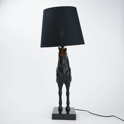 Horse table lamp featuring a detailed horse-shaped base with a premium finish, paired with a fabric lampshade that provides soft ambient lighting, designed as a decorative and functional lighting piece.