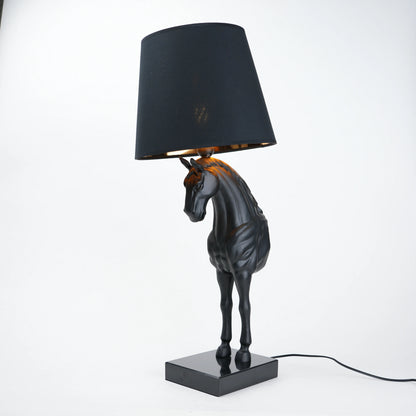 Horse table lamp featuring a detailed horse-shaped base with a premium finish, paired with a fabric lampshade that provides soft ambient lighting, designed as a decorative and functional lighting piece.