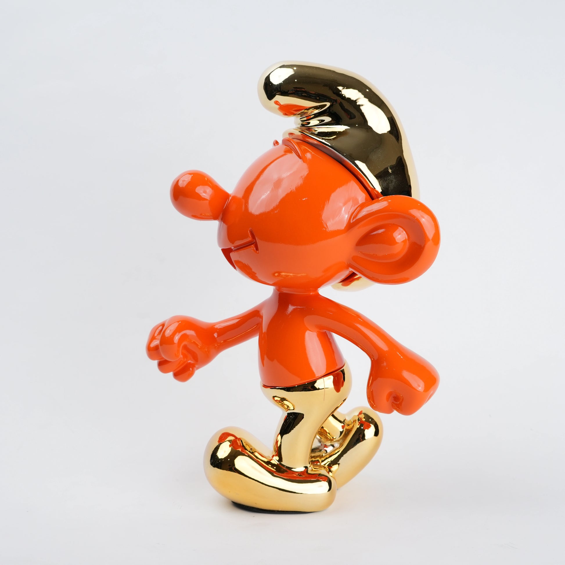 Resin toon character figurine featuring smooth rounded contours, expressive facial detailing, and a clean modern finish with subtle reflective accents in a stylized decorative form.