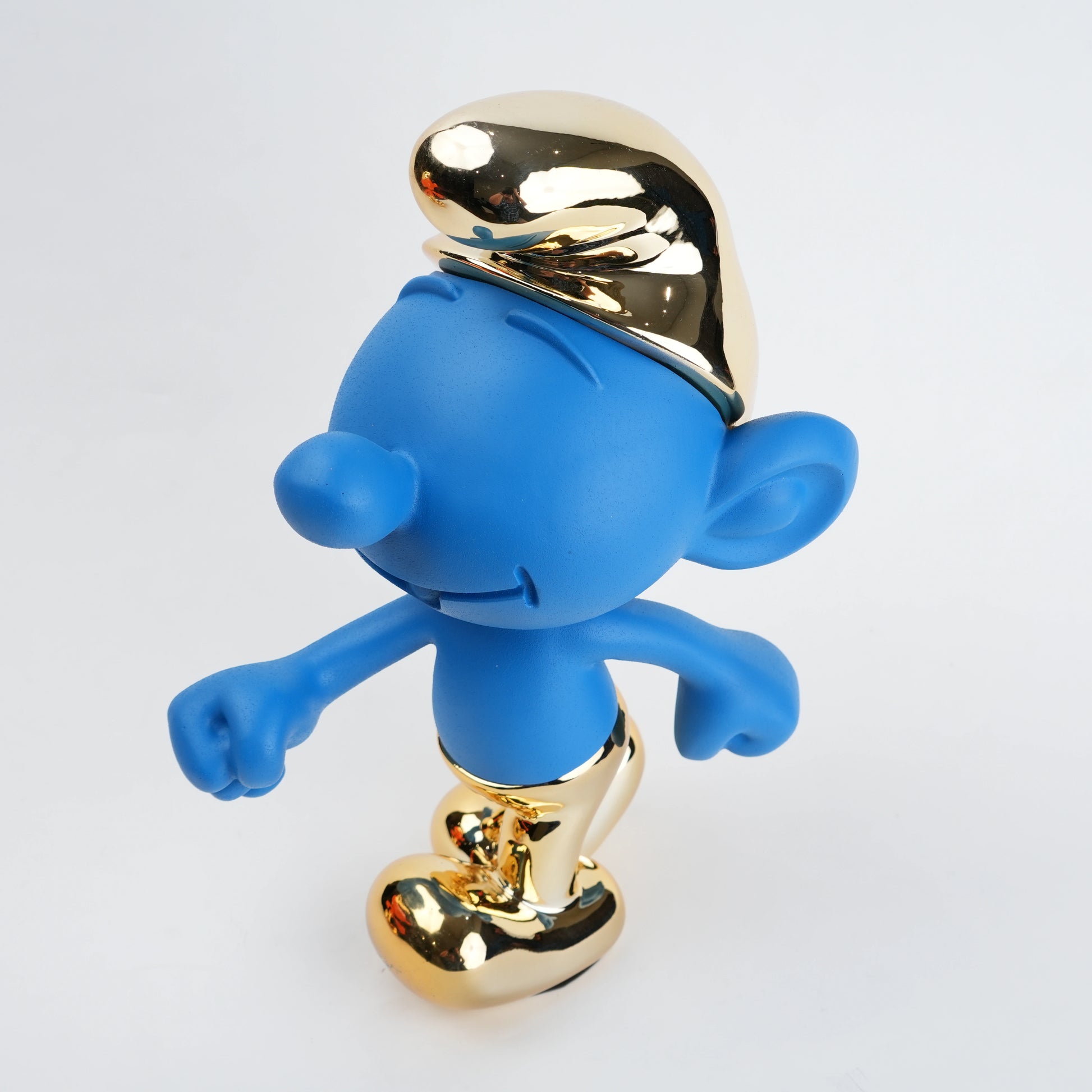 Resin toon character figurine featuring smooth rounded contours, expressive facial detailing, and a clean modern finish with subtle reflective accents in a stylized decorative form.