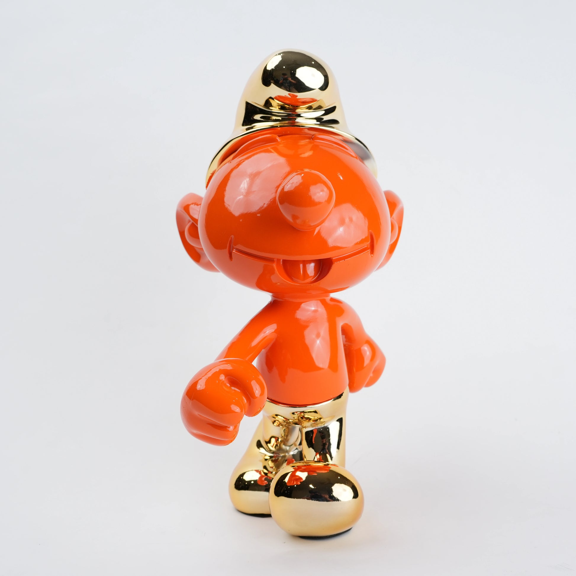 Orange and gold character figurine on a white background