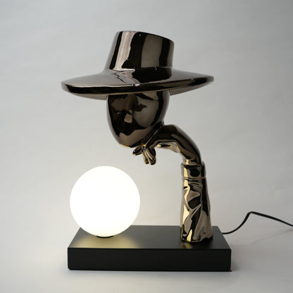 Modern table lamp with a unique design on a plain background
