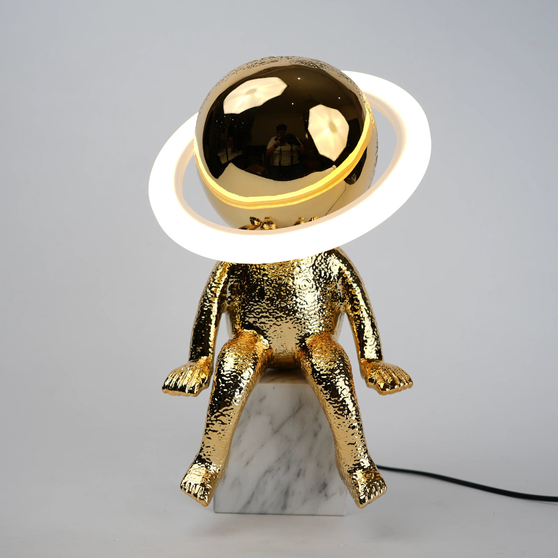 Cosmic Glow Table Lamp styled in modern decor setting