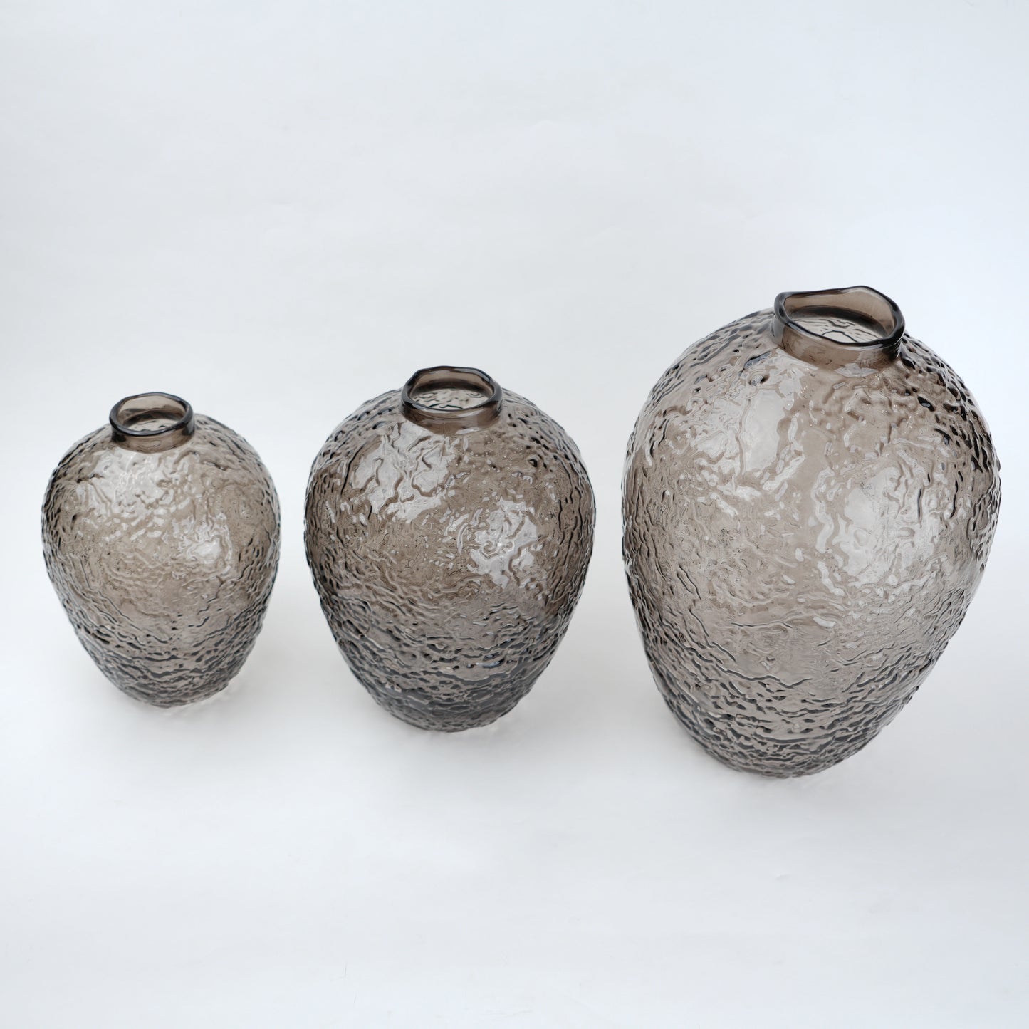 Hammered glass vase in warm grey finish available in three sizes for modern home decor styling