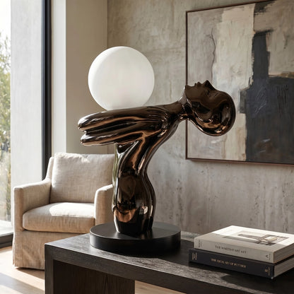 Black Sculptural Table Lamp with frosted globe light