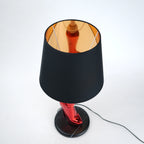 Table lamp with black base and shade on a white background