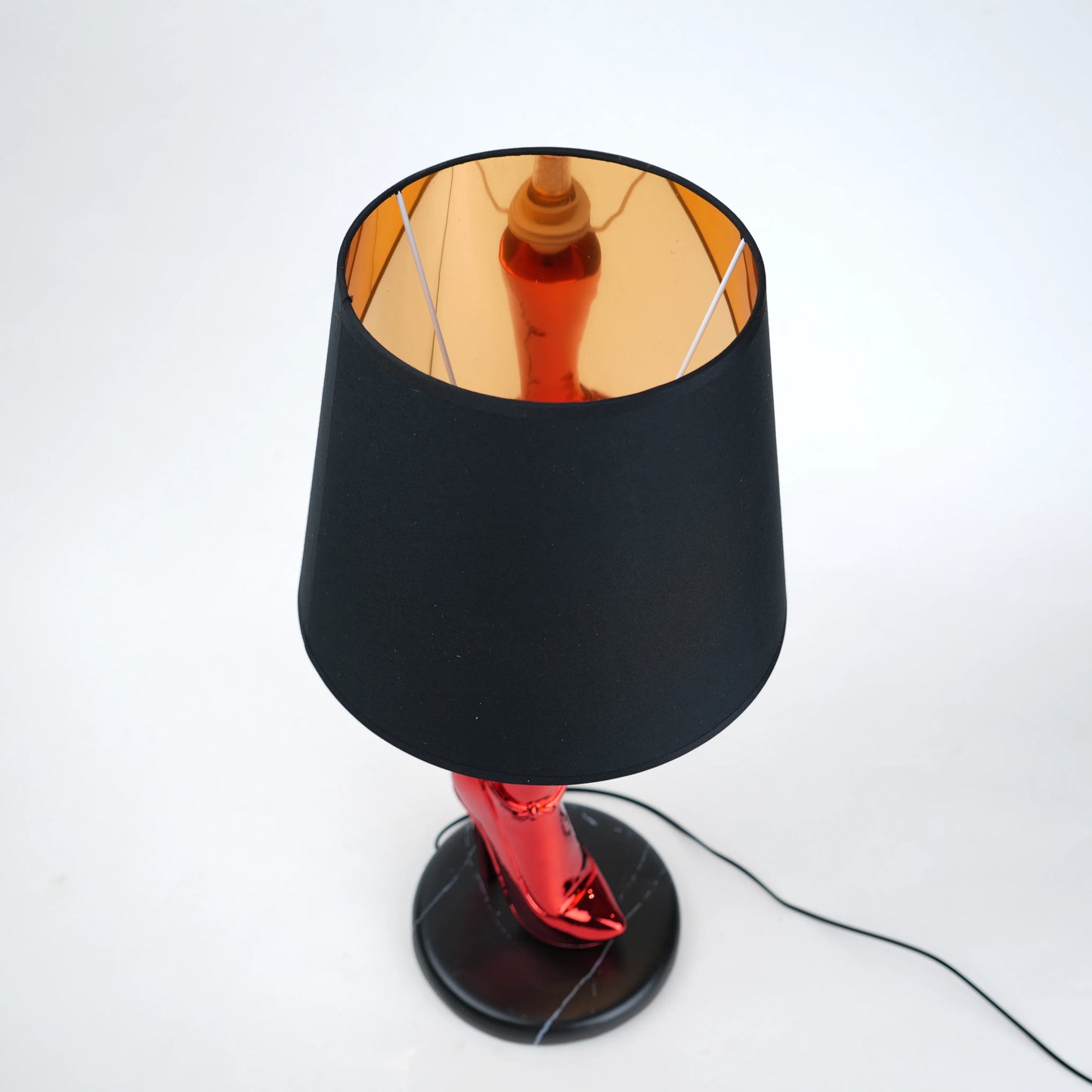 Table lamp with black base and shade on a white background